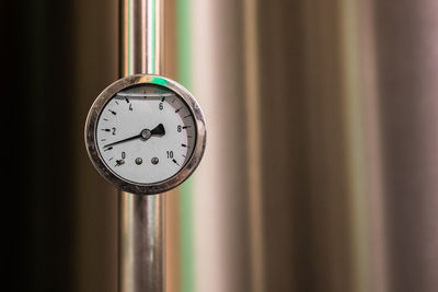 Close-up of gauge on pipe