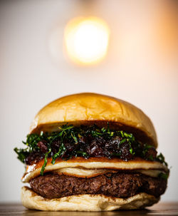 Close-up of burger against white background