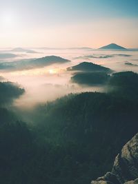 Hour before sunrise in bohemian switzerland, czech republic. full moon night ends