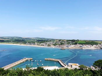 High angle view of swimming pool by sea against sky