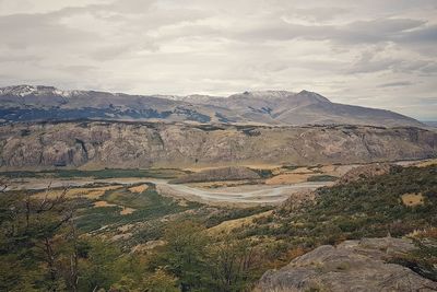 Scenic view of arid landscape against sky