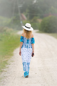 Rear view of a woman walking outdoors
