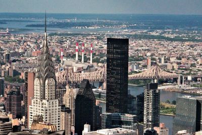 High angle view of modern buildings in city against sky