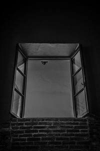 Low angle view of window in old building