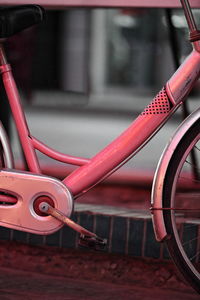 Close-up of bicycle parked on street