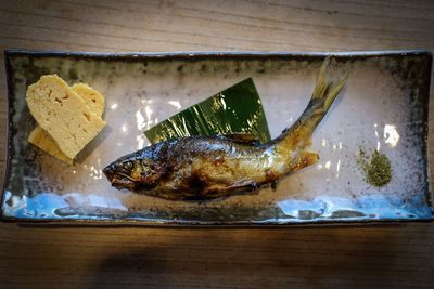 High angle view of fish in plate on table