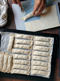 High angle view of person preparing food on table