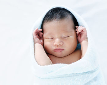 Close-up of cute baby boy sleeping