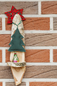Full frame shot of christmas decoration hanging against wall
