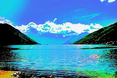 Scenic view of sea against blue sky