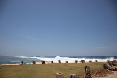 Scenic view of beach against clear sky