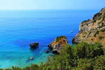 Scenic view of sea against clear blue sky