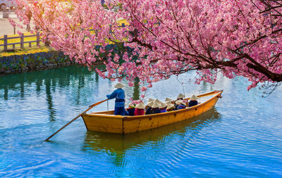 People in rowboat on canal