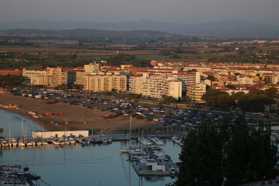 High angle view of buildings and trees in city