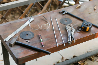 High angle view of rusty metal on table