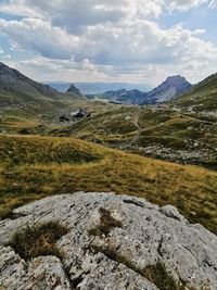 Scenic view of landscape and mountains against sky