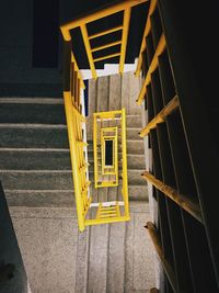 High angle view of yellow staircase in building