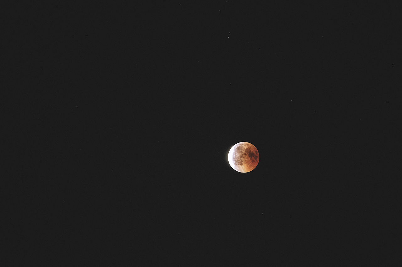 LOW ANGLE VIEW OF MOON AGAINST CLEAR SKY