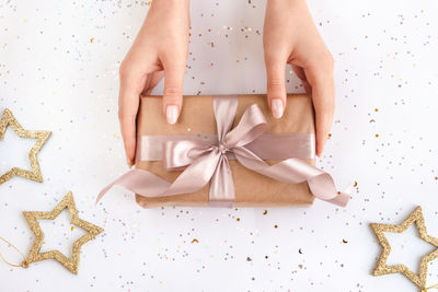 Midsection of woman with gift