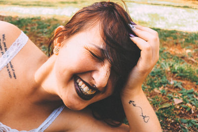 Close-up portrait of smiling young woman