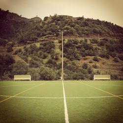 Low angle view of soccer field against sky