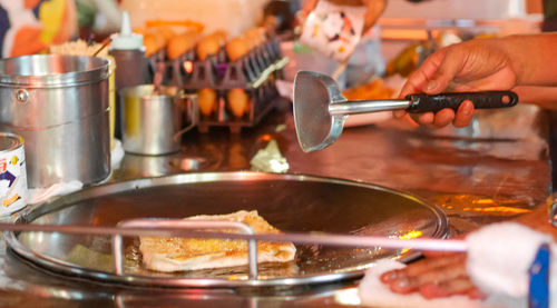 Close-up of person preparing food