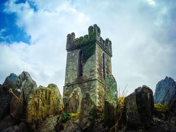 Low angle view of old ruin building against sky