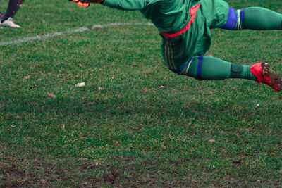 Low section of soccer player playing on field
