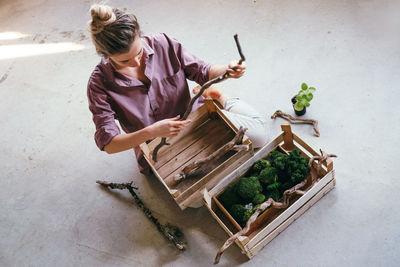 High angle view of woman holding food