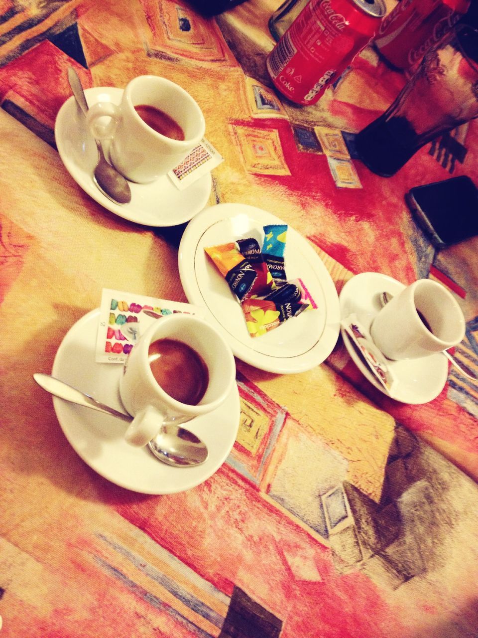 indoors, table, food and drink, coffee cup, drink, high angle view, coffee - drink, refreshment, saucer, still life, cup, plate, freshness, spoon, breakfast, coffee, directly above, food, tablecloth, tea cup