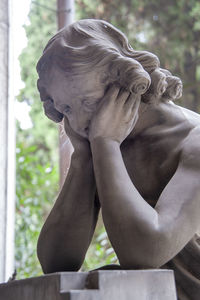 Close-up of angel statue in cemetery