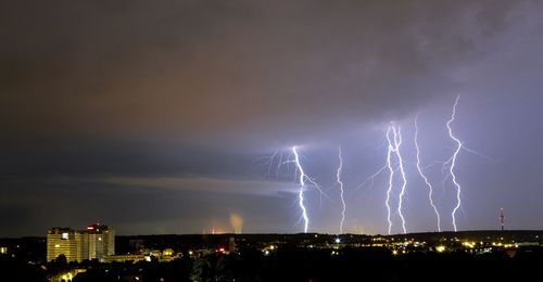 Lightning striking down on city