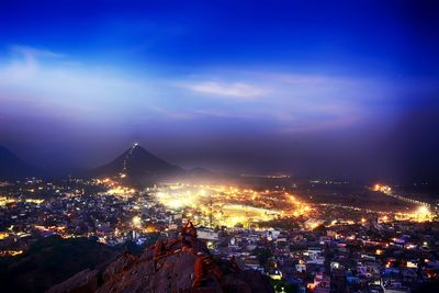 Aerial view of illuminated cityscape at night