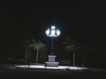 Illuminated street light at night