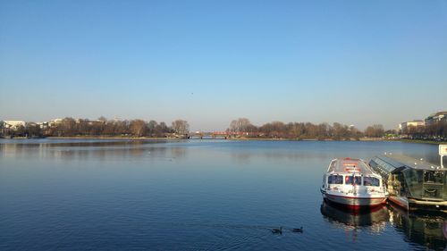 Scenic view of lake against clear blue sky