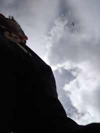 Low angle view of airplane flying in sky