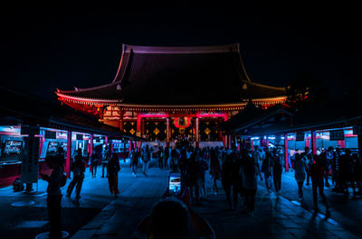 People in front of japanese temple at night
