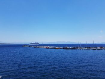 Scenic view of sea against clear blue sky