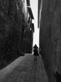 Narrow alley with buildings in background