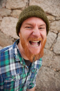 Portrait of smiling man wearing hat