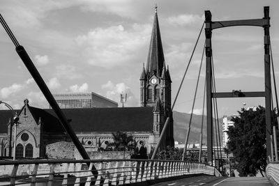 Panoramic view of bridge and buildings against sky