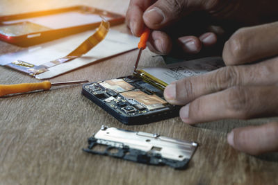 Midsection of person working on table