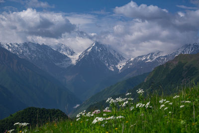 Scenic view of snowcapped mountains against sky