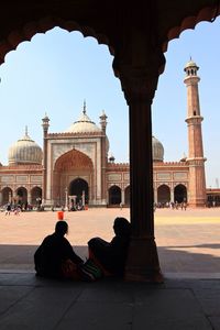 Tourists in front of historical building