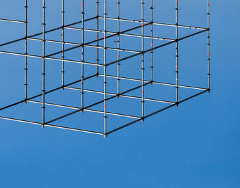 Low angle view of skylight against clear blue sky