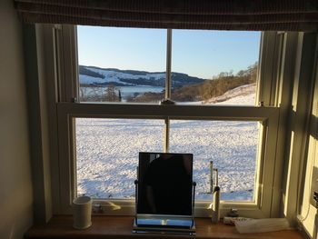 View of sea seen through window