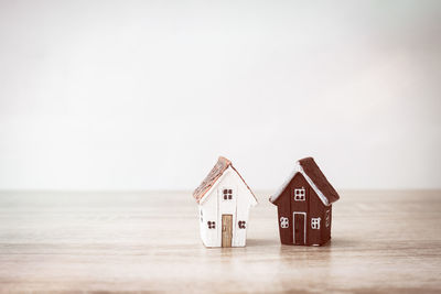 Close-up of model huts on table