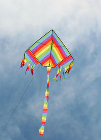 This is a symbol of freedom colorful kite flies high in the blue sky