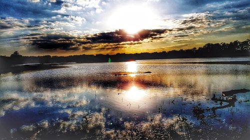 Scenic view of lake against sky during sunset