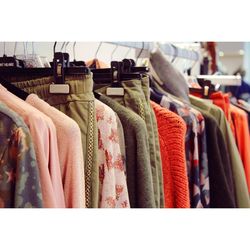 Close-up of clothes hanging on rack in store